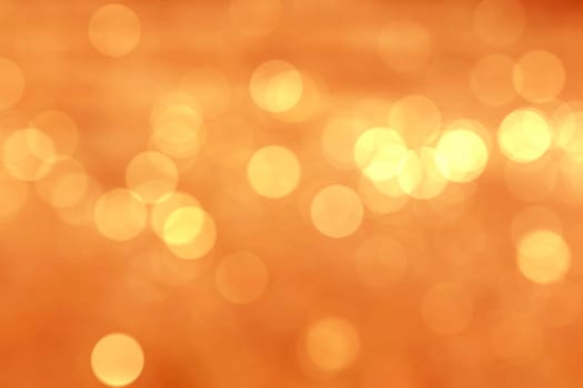 Abstract circular natural light orange bokeh background