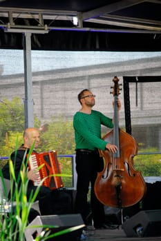 Mainz,Germany – June 14,2015: Martin Wagner on accordion and Hanns Höhn on double bass at the performance of the jazz group Tango Transit at the summer festival of the botanical garden of the University of Mainz on June 14,2015 in Mainz.