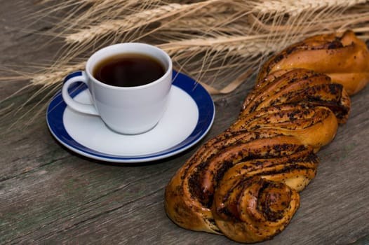 black coffee and roll with poppy, a still life on a subject drinks