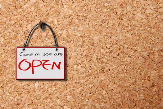 come in we are open hanging sign isolated on wall for adv or others purpose use