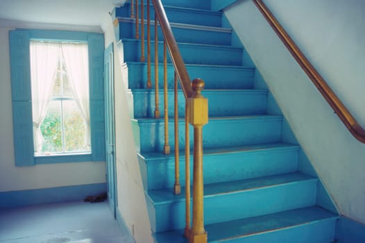 Stairs going up to the choir section in an old church n Vermont