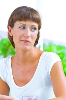 High key portrait of nice young woman  in summer environment