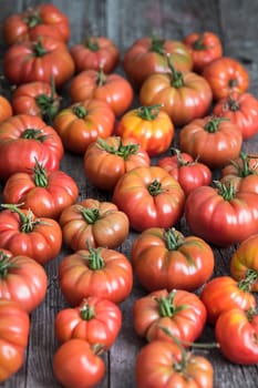 Vegetables, tomatoes on wooden desk