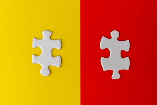 Pieces of white jigsaw puzzle on two different background