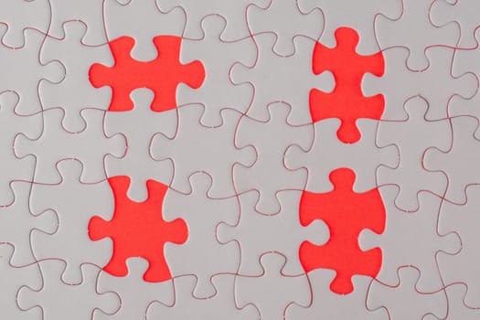 Missing piece of white jigsaw puzzle in red background