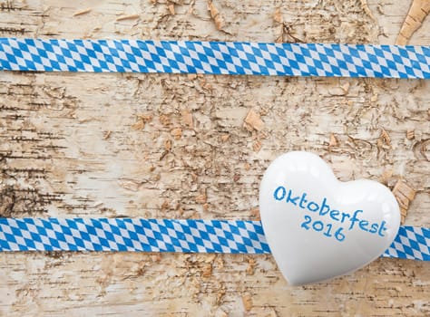 Rustic background with bavarian white and blue ribbon