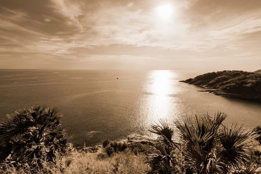 High angle view beautiful landscape of the island and Andaman sea from at Laem Phromthep Cape scenic point in evening is a famous attractions of Phuket Province, Thailand, on sepia color tone