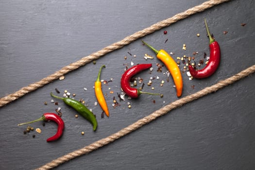 colorful chili peppers with a rope