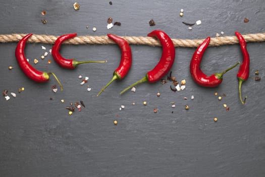 chalk board background with red chili peppers