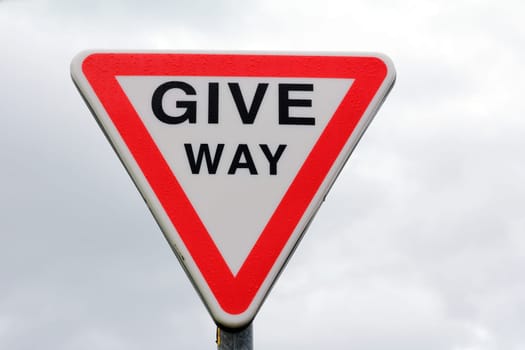 Road sign in England - Give Way. Sign off