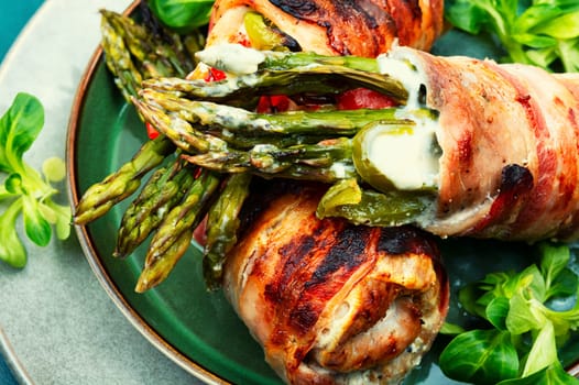 Asparagus rolls with beef and cream cheese. Close up, diet menu