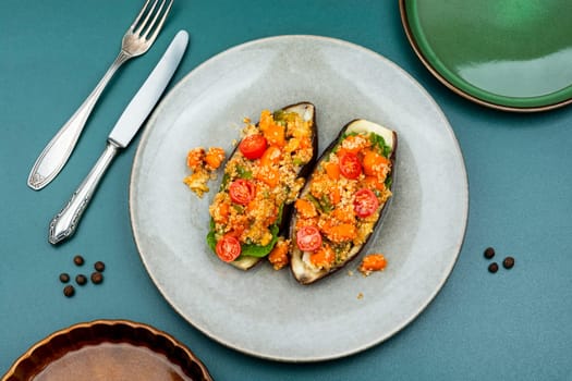 Grilled eggplant stuffed with pumpkin and quinoa. Vegetarian food recipe