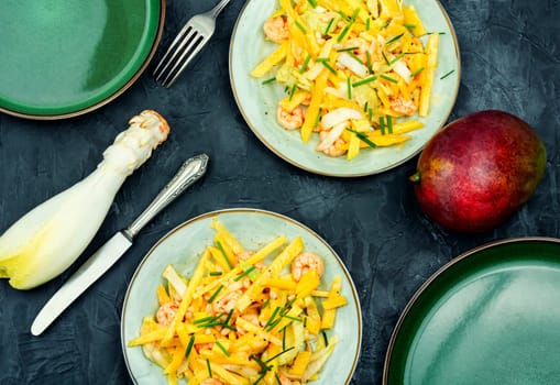 Fruit and vegetable salad with shrimps on the plate