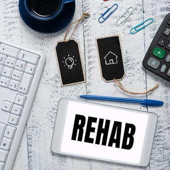 Writing displaying text Rehab, Internet Concept course treatment for drug alcohol dependence typically at residential