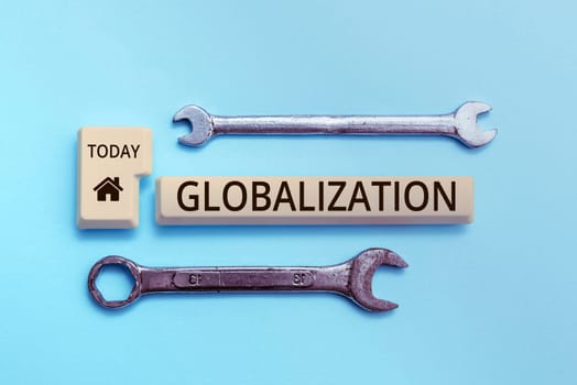 Hand writing sign Globalization, Concept meaning development of an increasingly integrated global economy marked