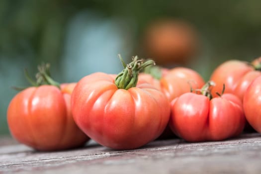 Vegetables, tomatoes on wooden desk