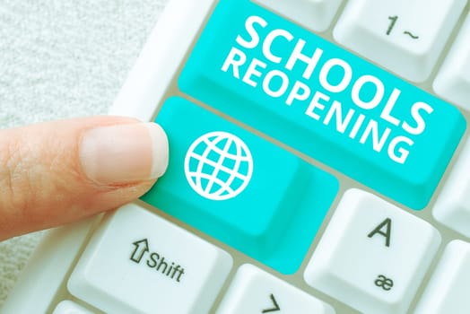 Hand writing sign Schools Reopening, Concept meaning classes are over for the time being End of the school day