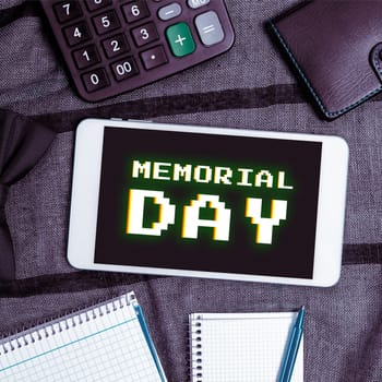 Hand writing sign Memorial Day, Word Written on To honor and remembering those who died in military service