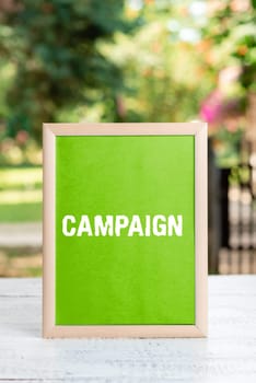 Conceptual display Campaign, Word Written on organized course of action to promote and sell product service