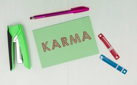Hand writing sign Karma, Business approach sum of a person actions in this and previous states of existence