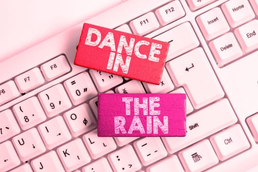 Writing displaying text Dance In The Rain, Word Written on Enjoy the rainy day childish activities happy dancing