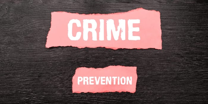 Hand writing sign Crime Prevention, Business showcase Federal Offense actions Illegal Activities punishable by Law