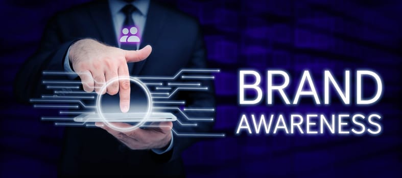 Hand writing sign Brand Awareness, Concept meaning name identifies one seller good as distinct from those of other seller