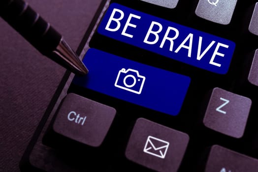 Conceptual caption Be Brave, Business concept ready to face and endure danger or pain showing courage Bold