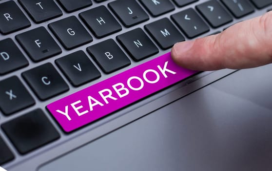 Text sign showing Yearbook, Word Written on publication compiled by graduating class as a record of the years activities