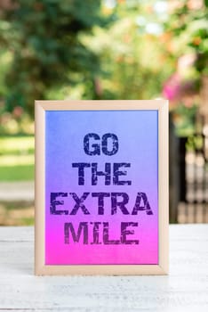 Writing displaying text Go The Extra Mile, Business showcase advising person to see new places change his mood