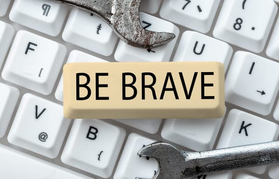 Hand writing sign Be Brave, Word Written on ready to face and endure danger or pain showing courage Bold