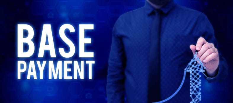 Conceptual caption Base Payment, Word Written on amount of pay for a standard work period, job, or position