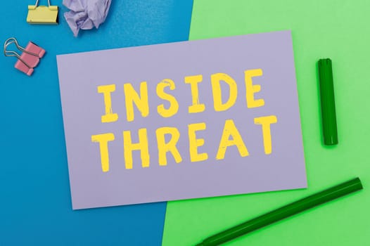 Conceptual display Inside Threat, Word Written on Information that only an insider would have Real information