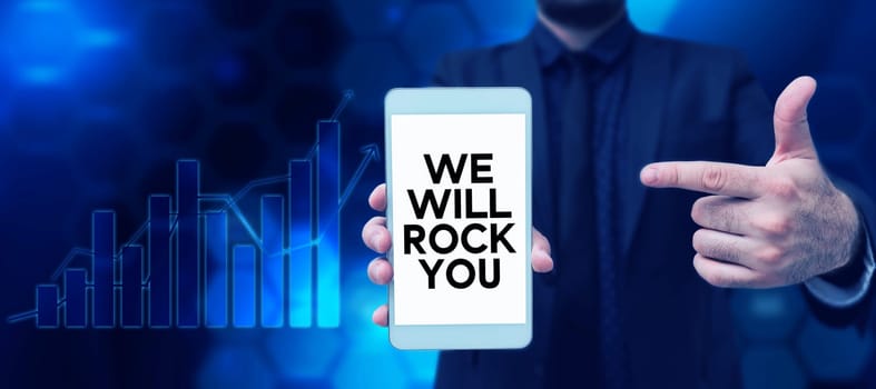 Conceptual caption We Will Rock You, Word Written on to be going out and facing the world and all that is in it