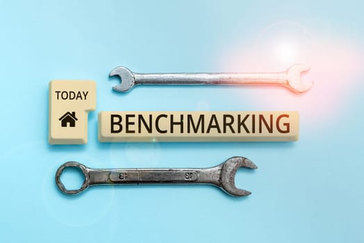 Text sign showing Benchmarking, Business showcase Evaluate something by comparison with a standard Strategy