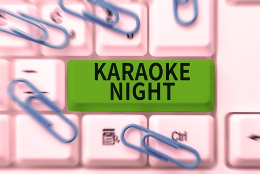 Text sign showing Karaoke Night, Business showcase Entertainment singing along instrumental music played by a machine
