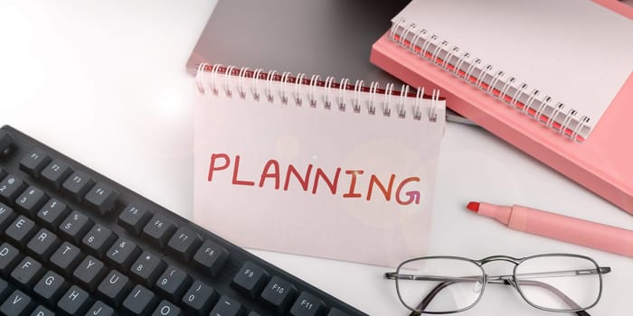 Writing displaying text Planning, Business overview process of thinking about the activities required to achieve a goal