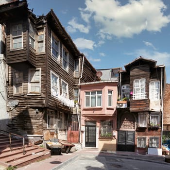 Beautiful old traditional wooden and stone houses, and stone staircase, in old Balat district, on a summer day, Istanbul, Turkey