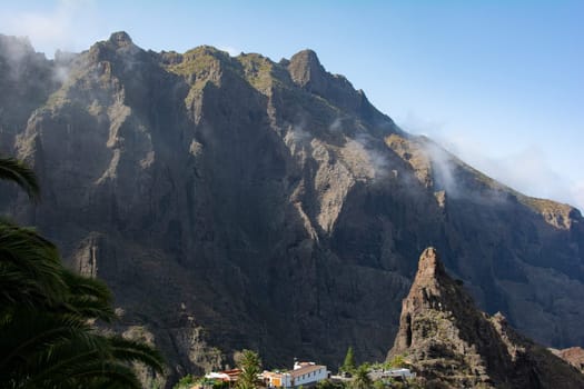 The small mountain village of Masca, mit Palm tree in the Teno mountains on the Canary Island of Tenerife, Spain, Europe
