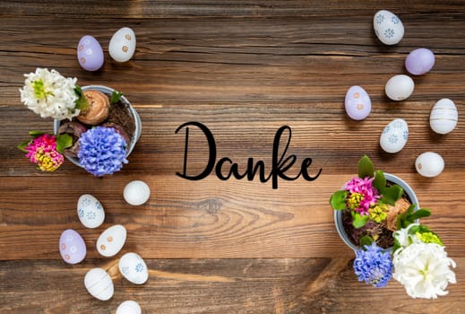 Easter Flat Lay With German Text Danke Means Thank You. Flowers With Easter Egg Decoration And Ornament. Hyacinth Flower Arrangement With Wooden, Vintage Background.