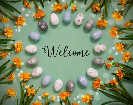 Flat Lay With English Text Welcome. Easter Egg Decoration With Orange Spring Flowers. Light Green Paper Background With Bright And Shiny Light Effect.
