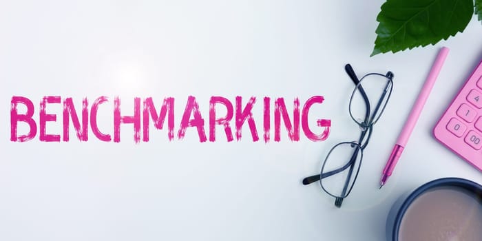 Text sign showing Benchmarking, Word Written on Evaluate something by comparison with a standard Strategy