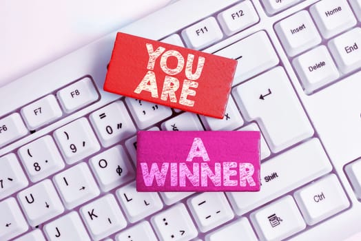 Hand writing sign You Are A Winner, Business concept motivation inspirational support for you accomplish goals