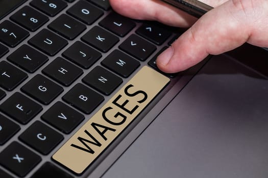 Text sign showing Wages, Business concept fixed regular payment earned for work or services paid on daily