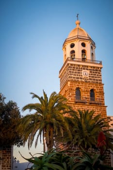 Teguise, Lanzarote, Spain, March 2023: View on the clock tower of the church of Teguise, former capital of the Spanish Canary island of Lanzarote