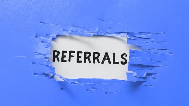 Writing displaying text Referrals, Business concept Act of referring someone or something for consultation review