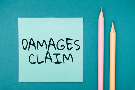 Writing displaying text Damages Claim, Business overview Demand Compensation Litigate Insurance File Suit