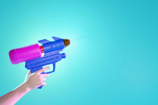 Songkran festival thailand, water gun in hands . space for text