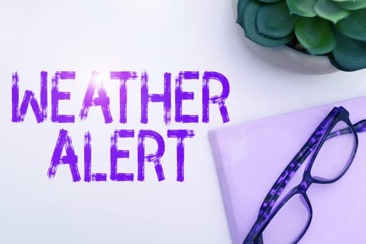Hand writing sign Weather Alert, Word for urgent warning on the state of the atmosphere at a place and time