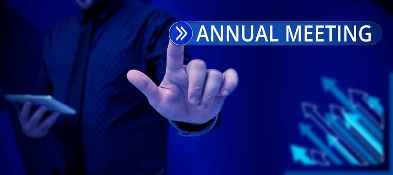 Sign displaying Annual Meeting, Concept meaning Yearly gathering of an organization interested shareholders
